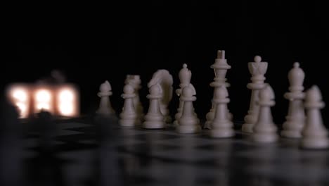 Close-up-of-a-rotating-chess-board,-set-up-in-the-ready-position-waiting-for-a-game-to-begin