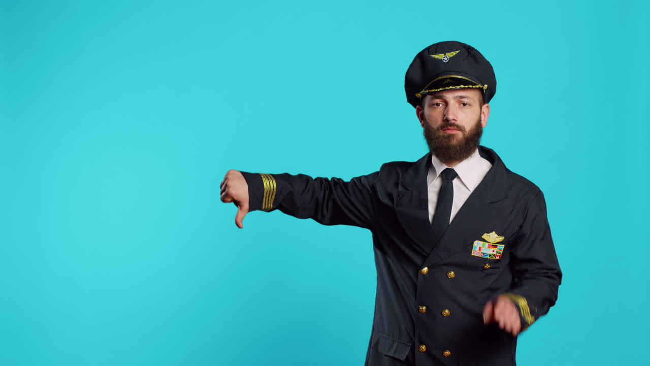 Professional aviator showing thumbs down sign