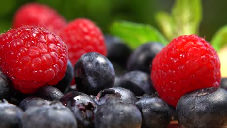 detail of blueberries and raspberries. macro trucking shot. assortment of berries. healthy food organic nutrition. 4k