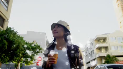 young woman walking in the street surrounded by white bubbles