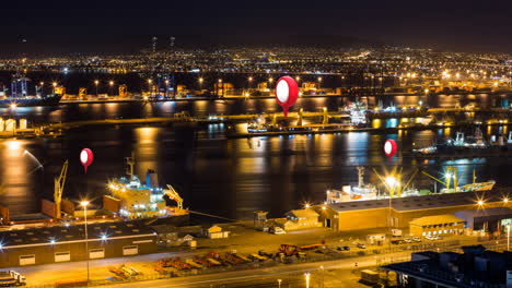 alfileres de ubicación y paisaje urbano por la noche