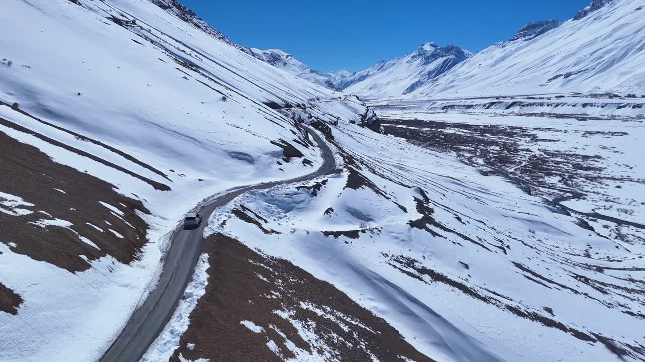 Snowy Mountain Road with a Car