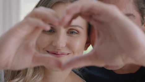 happy couple making heart shape with hands gesturing romantic commitment enjoying loving relationship on valentines day 4k footage