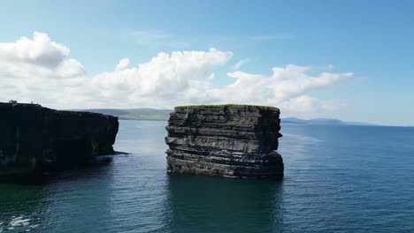 drone shot flying around downpatrick head from left to right