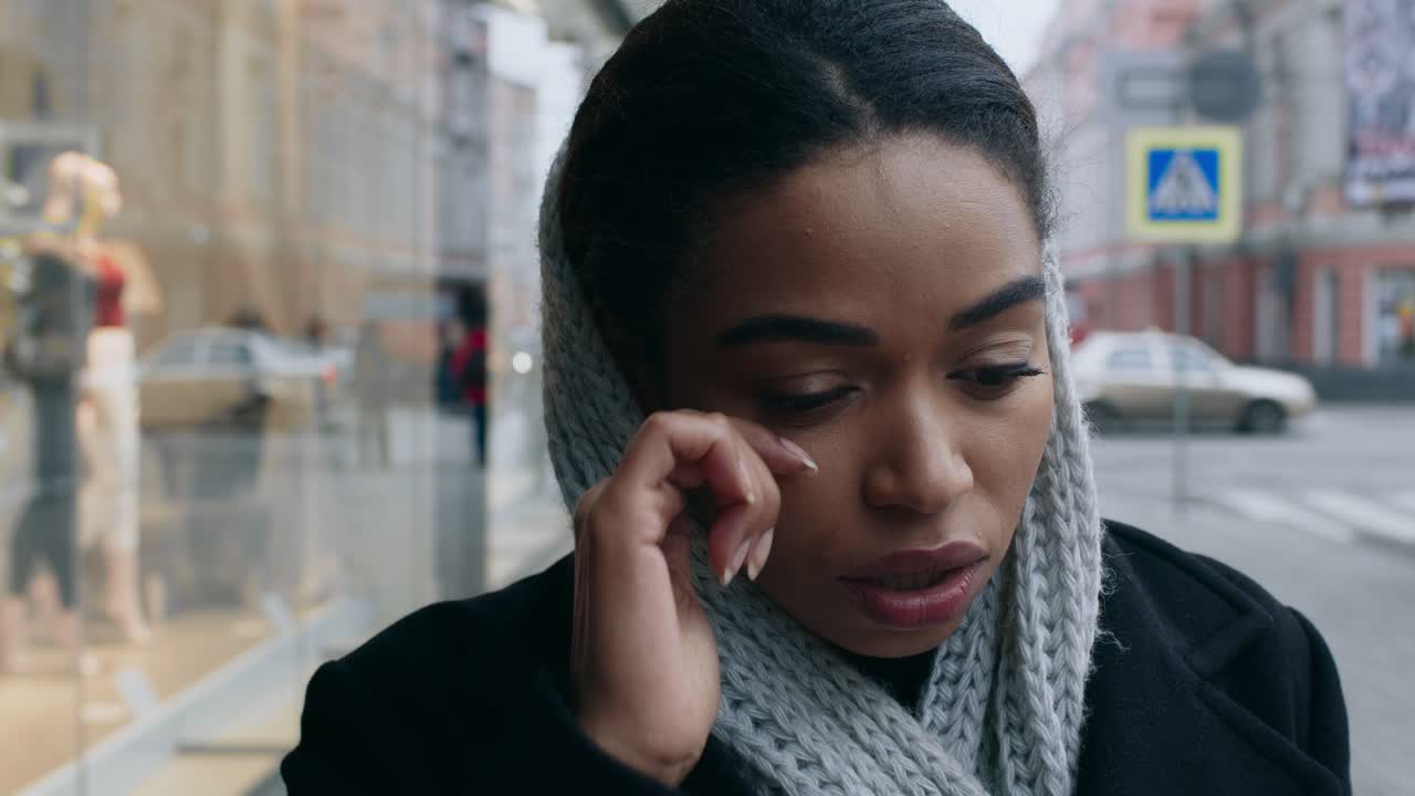 A Woman's Sadness on a City Street