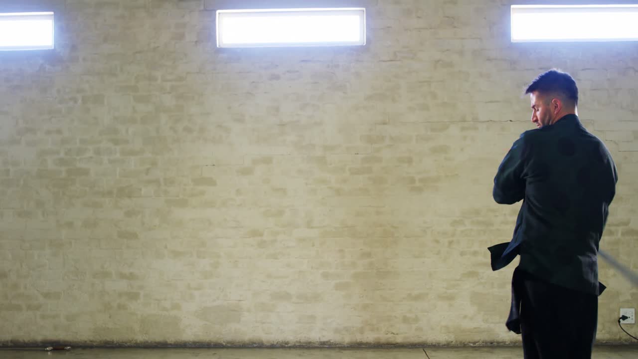 Kung fu fighter practicing martial arts with sword 4k