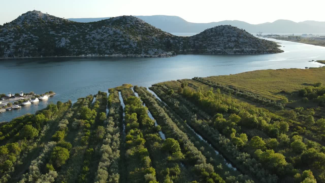 Where river Neretva meets the sea and creates very fertile soil for ecological agricultural, Croatia from above