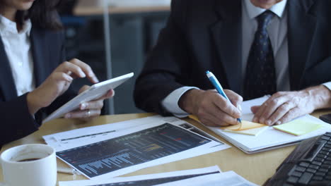 busy finance professionals analyzing data at the office