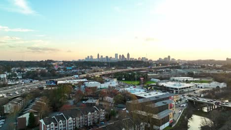 distant view of atlanta city skyline with traffic jam on bustling highways and roads