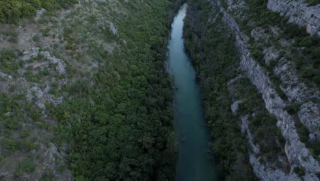 full-length descriptive panning drone video moving over the canyon of lake zrmanja in croatia