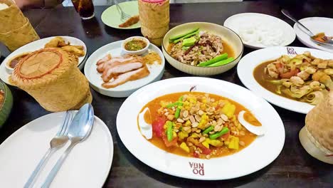 a vibrant display of isan cuisine dishes