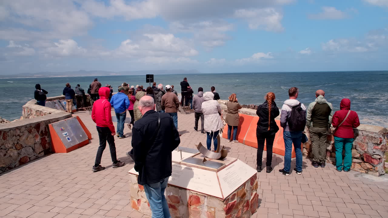 Tourists in whale season do ecotourism whale watching from Gearings in Hermanus