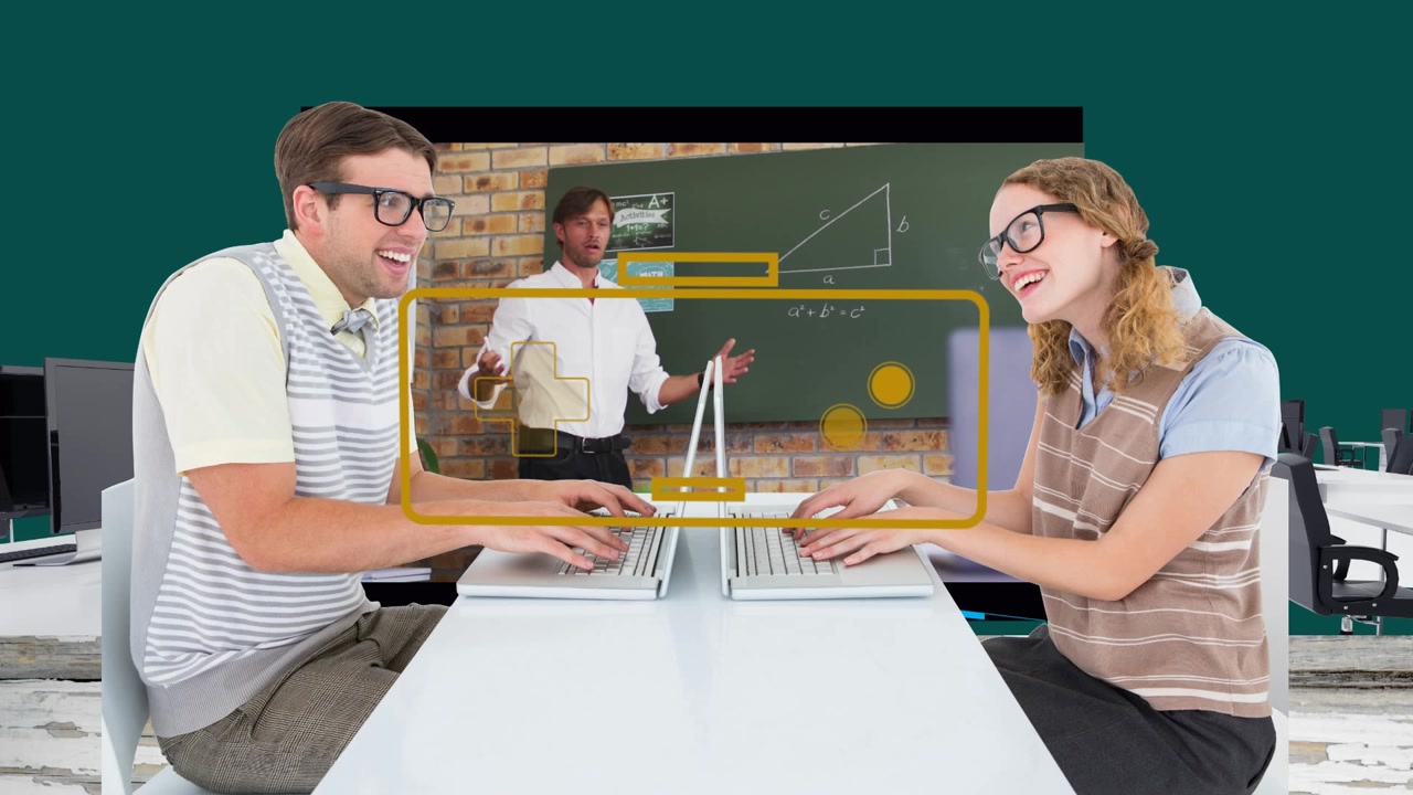 Colleagues Working on Laptops with Digital Graphics in Office