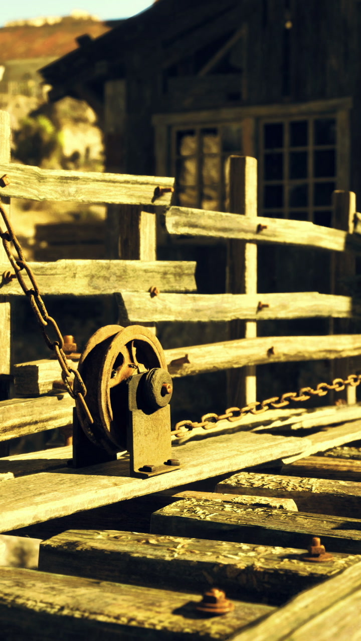 Wooden structures in a deserted mining town at golden hour