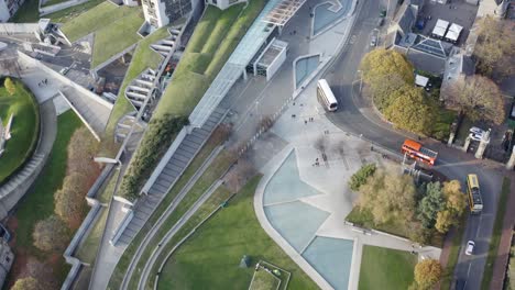 top down fly-over of the holyrood scottish parliament and gardens | edinburgh, scotland | 4k at 30fps