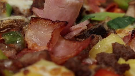 close-up of a bacon-topped pizza cooking process.