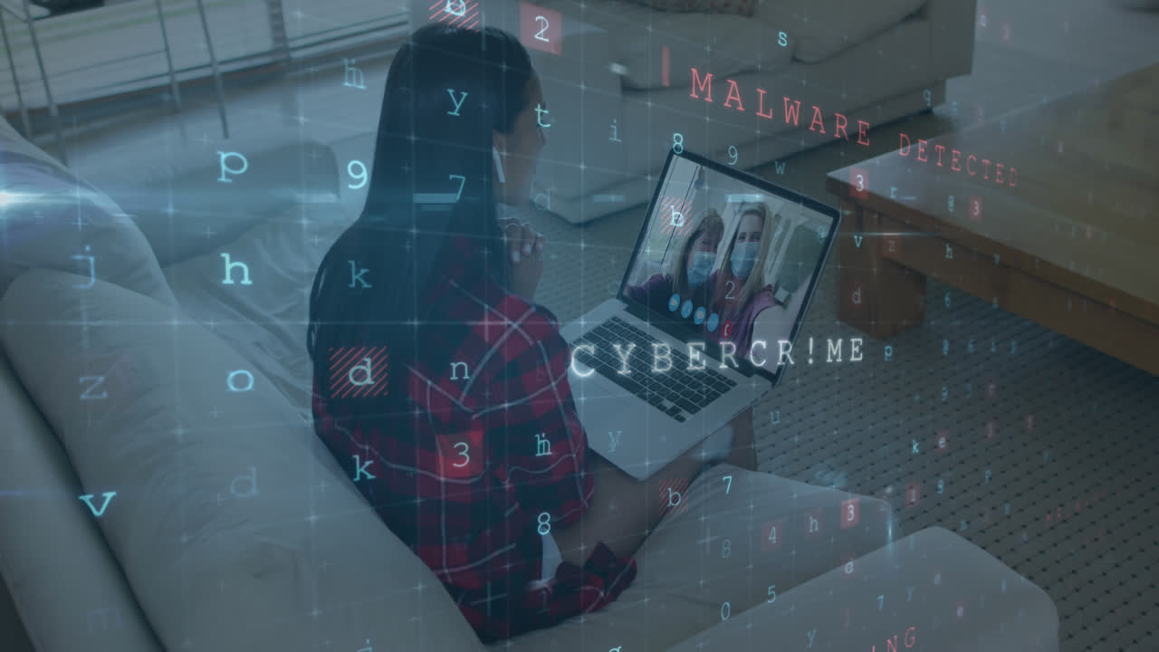 Animation of virus scanning over biracial woman having video call on laptop