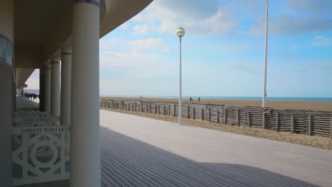 Les-Planches-Promenade-And-The-Bathing-Cabins-In-Deauville-Beach-In-Calvados,-Normandy,-France