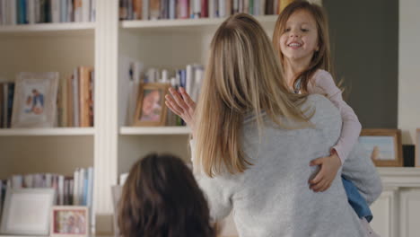 happy-mother-holding-little-girl-dancing-with-daughter-playing-game-mother-and-father-at-home-having-fun-with-children-enjoying-weekend-together-4k