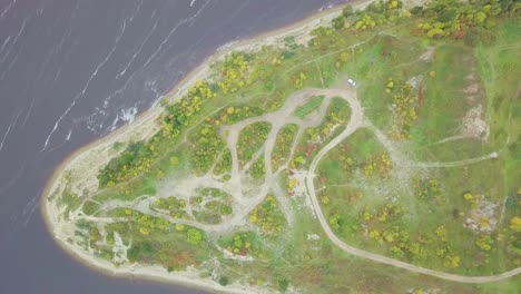 aerial view of a river bend with autumn foliage