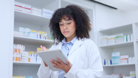 portrait of a friendly pharmacist checking online