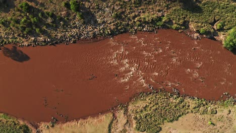 Aerial-shot-of-Masai-Mara-River-Landscape,-Beautiful-Lush-Green-Scenery-Top-Down-Vertical-Drone-View-in-Maasai-Mara-National-Reserve-in-Kenya,-Africa,-Establishing-Shot-from-High-Up-Above