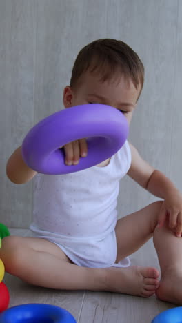baby playing with rings