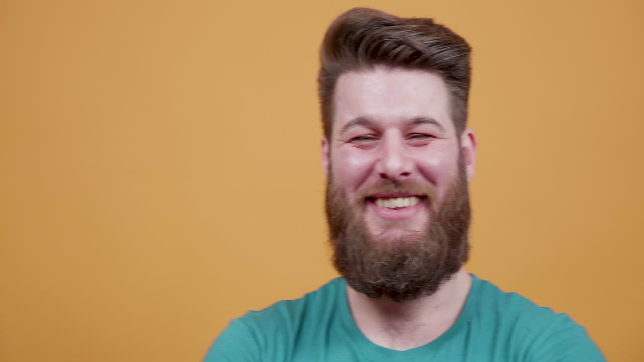 Bearded man smiling and laughing