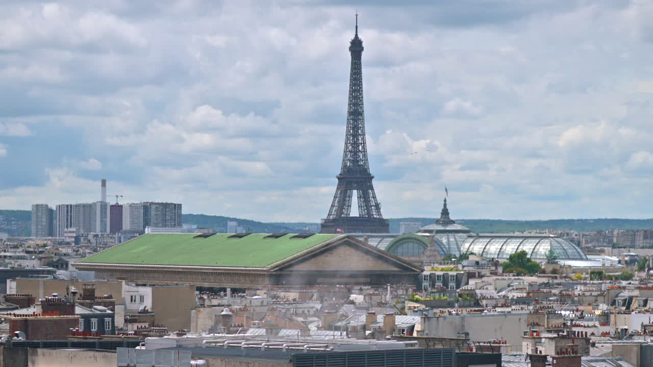 Distant view of the Eiffel Tower with buildings surrounding it in Paris, France