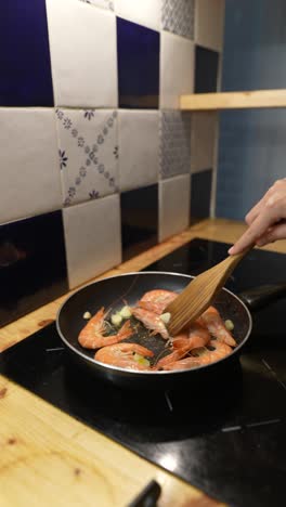 cooking shrimp in a kitchen