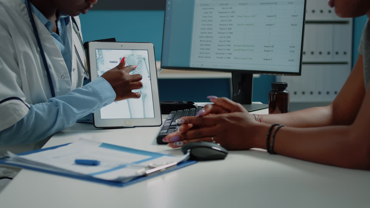 Doctor explaining skeleton anatomy to patient