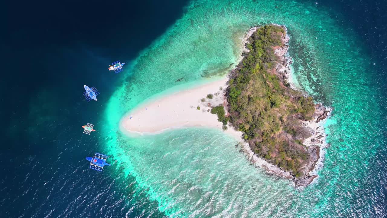 Drone shot of Tacling Island, splendor of beauty turquoise tranquil waters, in Linapacan, Philippines