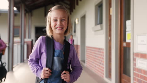 girl with backpack at school