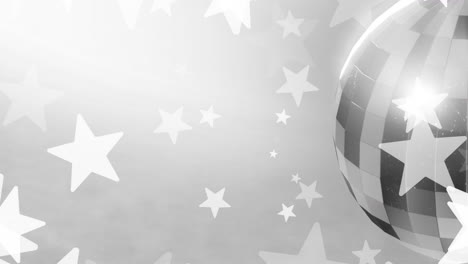 animation of white star over silver disco ball on grey background