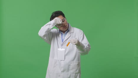 실험관 을 검사 하는 과학자