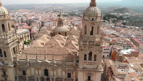 Spain-Jaen-Cathedral,-Catedral-de-Jaen,-flying-shoots-of-this-old-church-with-a-drone-at-4k-24fps-using-a-ND-filter-also-it-can-be-seen-the-old-town-of-Jaen