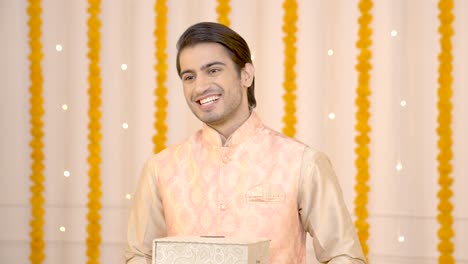 indian man with gifts on diwali