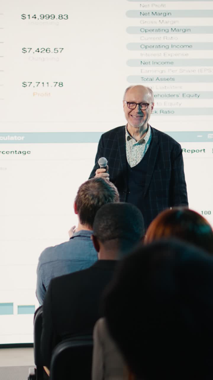 Vertical Video Diverse audience clapping hands for senior businessman with microphone
