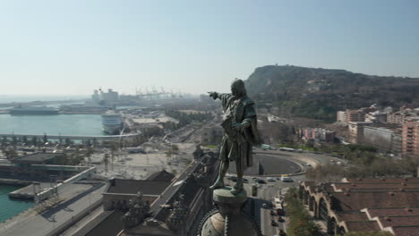 Amazing-footage-of-Columbus-statue-above-city.-Orbit-shot-around-historic-landmark-near-port.-Barcelona,-Spain