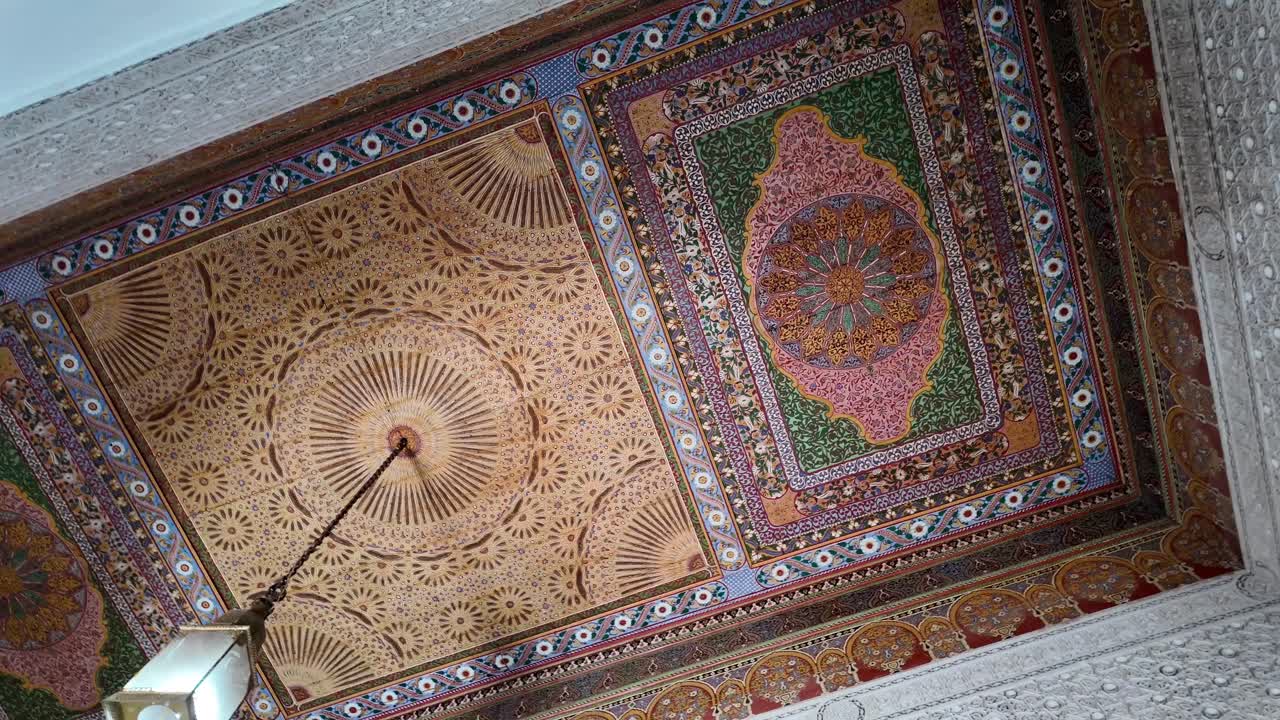 Painted decorated ceiling wall in Morocco home, riad inside medina