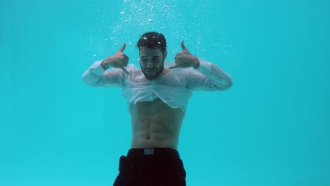 man doing gesture underwater