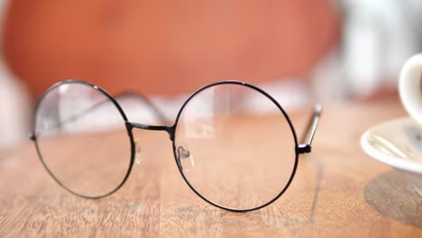 round glasses on a wooden table
