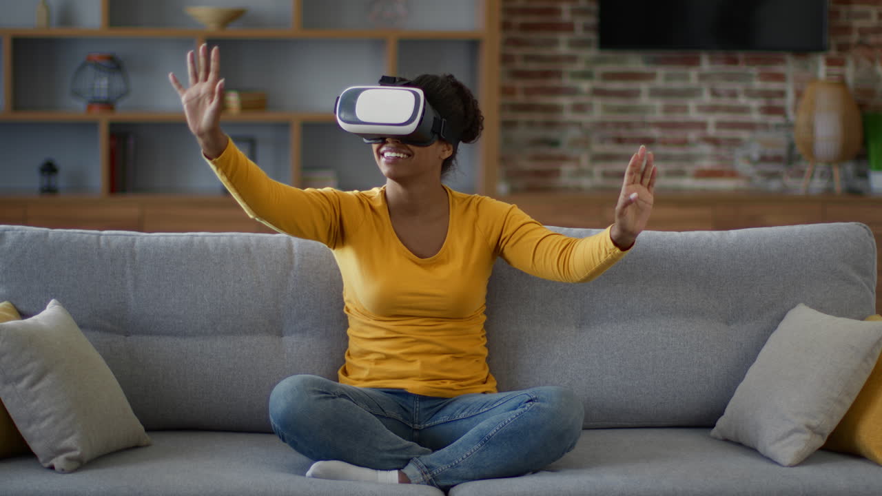 Woman Experiencing Virtual Reality on a Couch