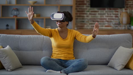 woman experiencing virtual reality on a couch
