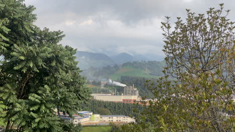 factory emitting pollution into the atmosphere. contamination, gas emissions. smoke,fume. industry nature damage
