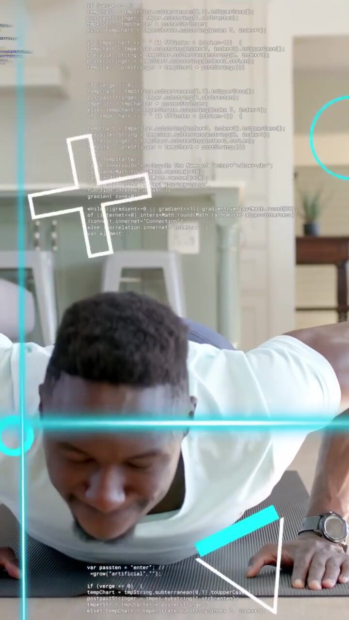 Vertical video: Man lowering chest then pushing up as teal code overlay tracking form for fitness