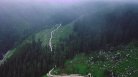 beautiful aerial shot of drone moving through clouds revealing river - road
