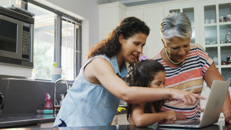 Happy-family-using-laptop-in-kitchen-4k