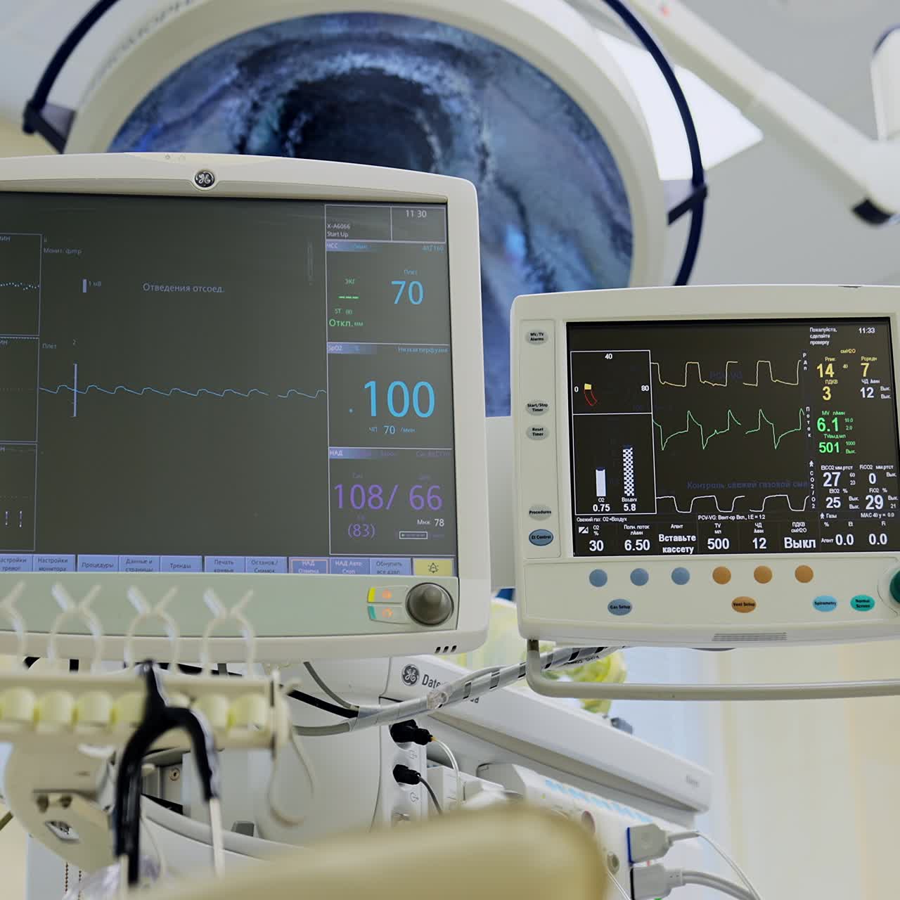 Pair of monitors displaying the condition of a patient at operation. Medical respiratory and life support systems in a hospital clinic