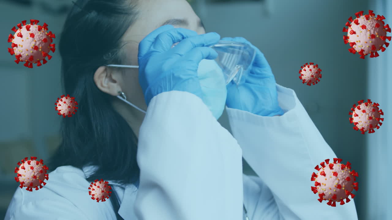 Animation of virus cells over asian female doctor with face mask